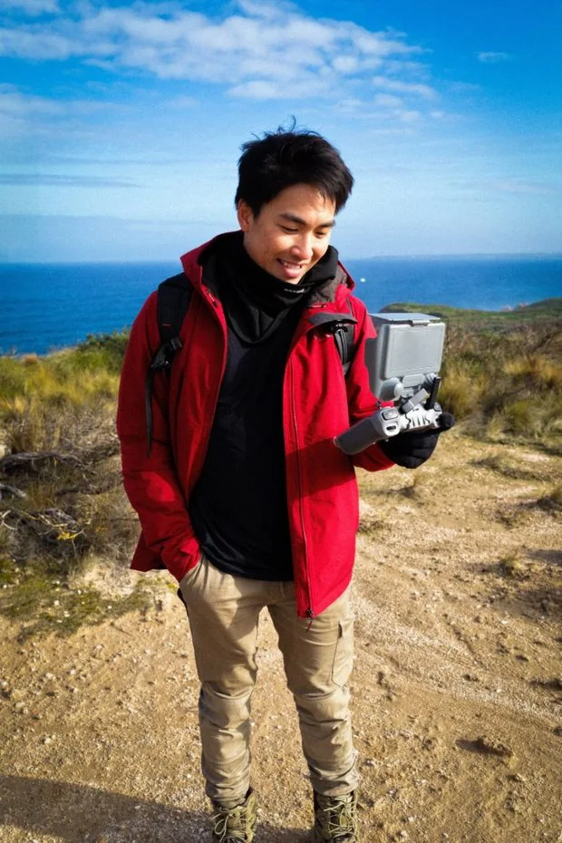 Jason Nguyen holding a drone controller